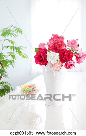 Roses in a vase and macaroons View Large Photo Image Stock Photography - Roses in a vase and macaroons. Fotosearch
