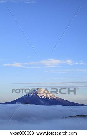 Stock Photo - Sea of??clouds and morning glow at Mount Fuji. Fotosearch