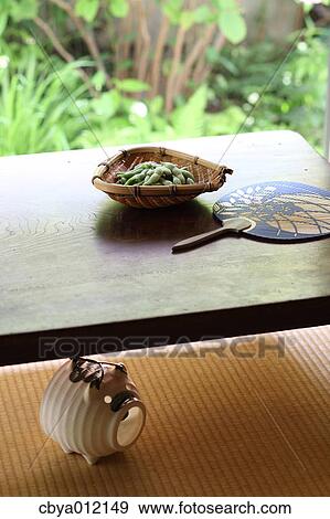 Soybeans and paper fan on a wooden table View Large Photo Image Stock Photo - Soybeans and paper fan on a wooden table. Fotosearch