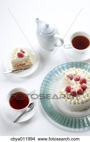 Picture - Strawberry shortcake and tea on a table. Fotosearch