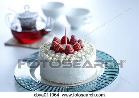 Strawberry shortcake with candle on a glass plate View Large Photo Image Picture - Strawberry shortcake with candle on a glass plate. Fotosearch