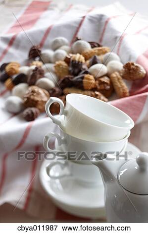 Tea cups and assorted pastry View Large Photo Image Stock Photo - Tea cups and assorted pastry. Fotosearch