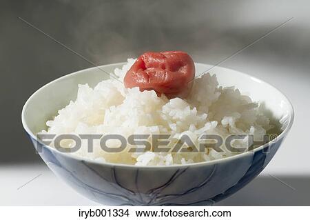 Picture - White rice and sour plum. Fotosearch