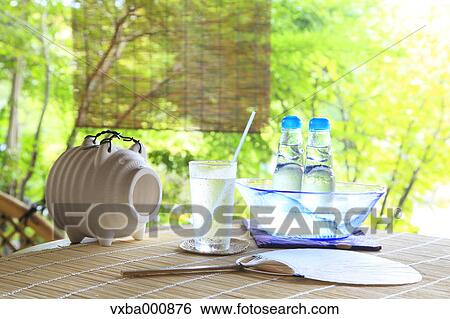 Stock Photograph - Bamboo blind soda and mosquito coil. Fotosearch
