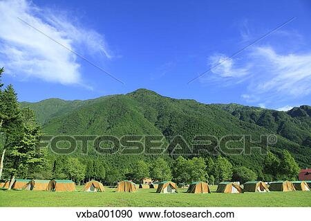 Stock Image - Blue sky and camping area. Fotosearch