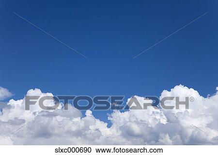 Blue sky and clouds View Large Photo Image Stock Image - Blue sky and clouds. Fotosearch