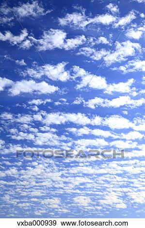 Blue sky and clouds View Large Photo Image Stock Photo - Blue sky and clouds. Fotosearch