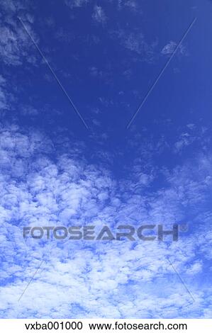 Clouds and blue sky View Large Photo Image Stock Image - Clouds and blue sky. Fotosearch