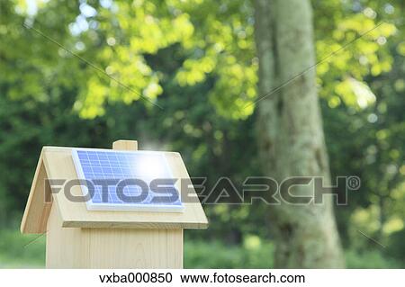 Miniature wooden house with solar panels View Large Photo Image Stock Image - Miniature wooden house with solar panels. Fotosearch