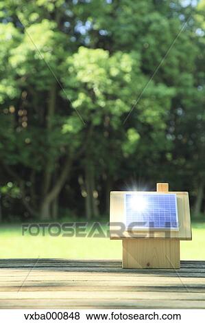Miniature wooden house with solar panels View Large Photo Image Stock Photo - Miniature wooden house with solar panels. Fotosearch