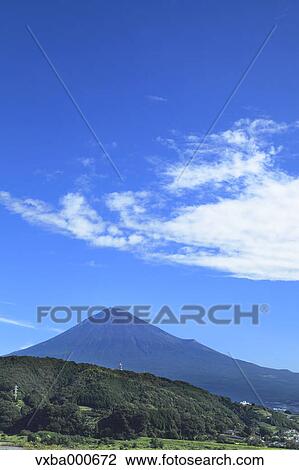 Stock Image - Mount Fuji and blue sky with clouds. Fotosearch