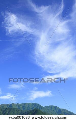 Mountains and blue sky with clouds View Large Photo Image Stock Photograph - Mountains and blue sky with clouds. Fotosearch