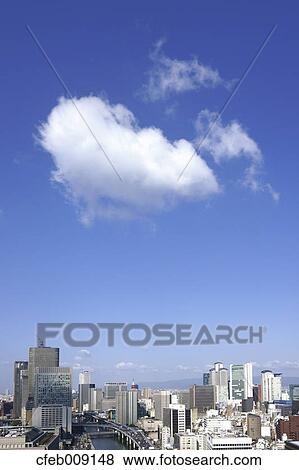 Osaka cityscape and cottony clouds View Large Photo Image Stock Photo - Osaka cityscape and cottony clouds. Fotosearch