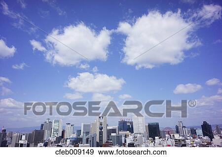 Osaka cityscape and cottony clouds View Large Photo Image Stock Photo - Osaka cityscape and cottony clouds. Fotosearch