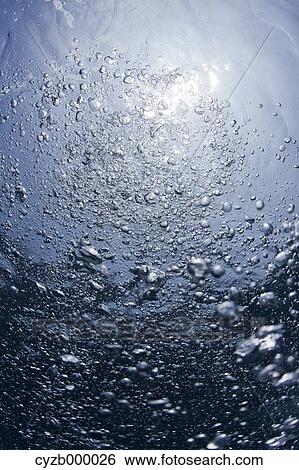 Stock Photograph - Oxygen bubbles underwater. Fotosearch