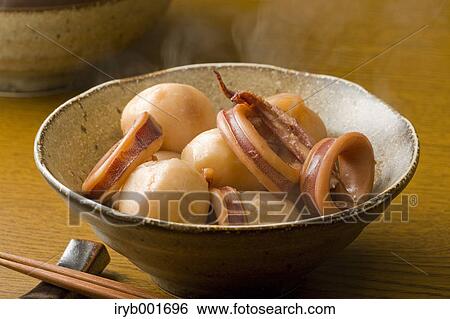 Stock Photograph - Simmered squid and potatoes. Fotosearch