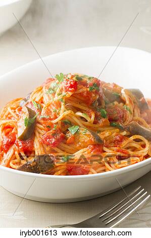 Spaghetti with tomato sauce and eggplant View Large Photo Image Stock Image - Spaghetti with tomato sauce and eggplant. Fotosearch