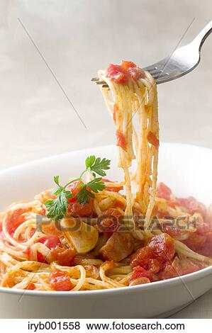 Spaghetti with tomato sauce View Large Photo Image Stock Photo - Spaghetti with tomato sauce. Fotosearch