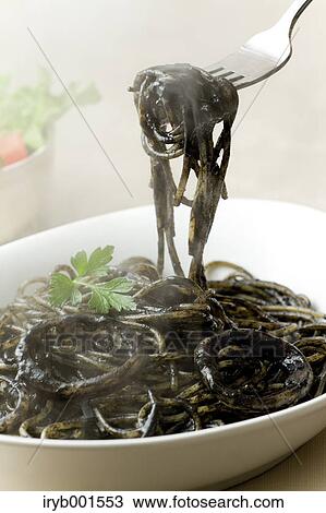 Squid ink spaghetti View Large Photo Image Stock Image - Squid ink spaghetti. Fotosearch
