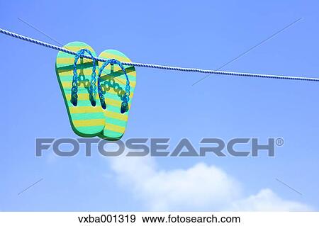 Beach sandals and sky View Large Photo Image Stock Photo - Beach sandals and sky. Fotosearch