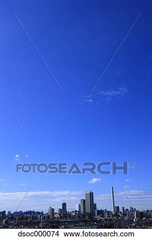 Blue sky with clouds and cityscape View Large Photo Image Picture - Blue sky with clouds and cityscape. Fotosearch