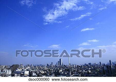 Blue sky with clouds and cityscape View Large Photo Image Stock Image - Blue sky with clouds and cityscape. Fotosearch