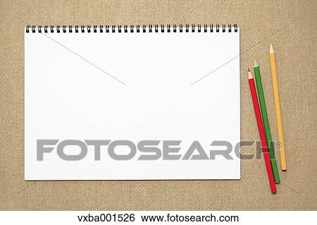 Stock Photograph - Colored pencils and sketchbook. Fotosearch