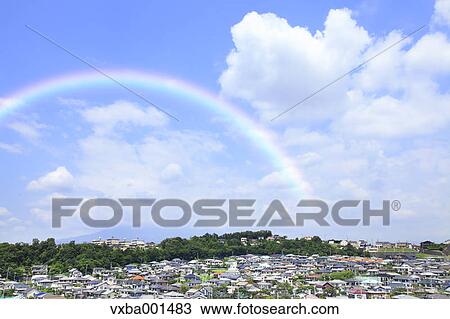 Stock Image - Residential area and rainbow, Shizuoka Prefecture. Fotosearch