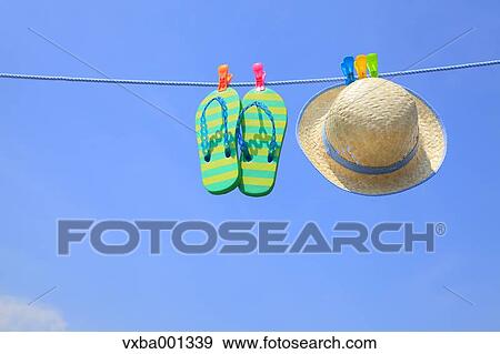 Straw hat beach sandals and blue sky View Large Photo Image Stock Photo - Straw hat beach sandals and blue sky. Fotosearch