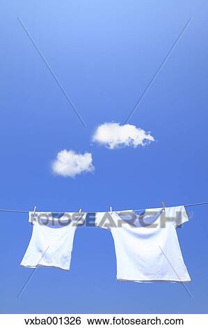 T-shirts and sky with clouds View Large Photo Image Stock Photograph - T-shirts and sky with clouds. Fotosearch