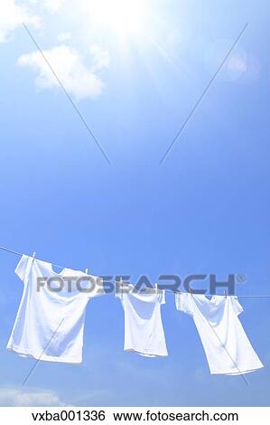 T-shirts and sky with clouds View Large Photo Image Stock Photograph - T-shirts and sky with clouds. Fotosearch