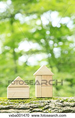 Stock Image - Wooden houses made of building blocks. Fotosearch