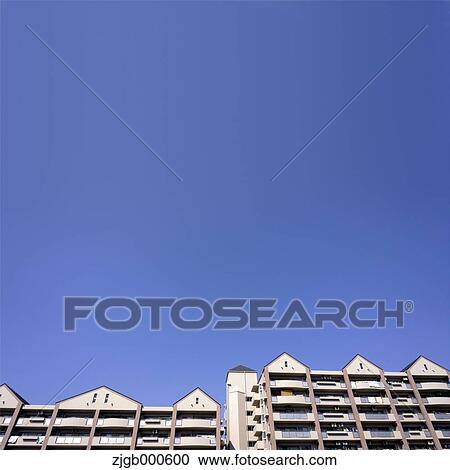 Apartment buildings and blue sky View Large Photo Image Stock Image - Apartment buildings and blue sky. Fotosearch