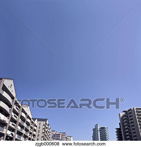 Apartment buildings and blue sky View Large Photo Image Stock Photo - Apartment buildings and blue sky. Fotosearch