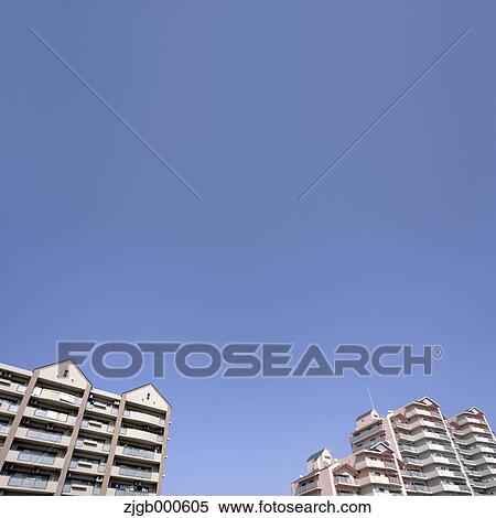 Apartment buildings and blue sky View Large Photo Image Stock Photography - Apartment buildings and blue sky. Fotosearch