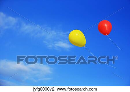 Balloons flying in the blue sky View Large Photo Image Stock Image - Balloons flying in the blue sky. Fotosearch