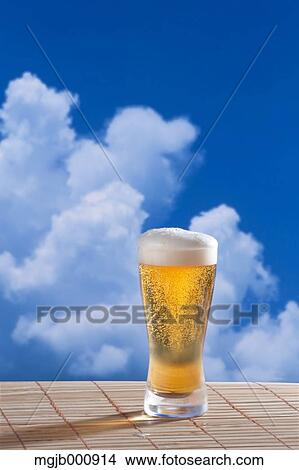 Beer and blue sky with clouds View Large Photo Image Picture - Beer and blue sky with clouds. Fotosearch
