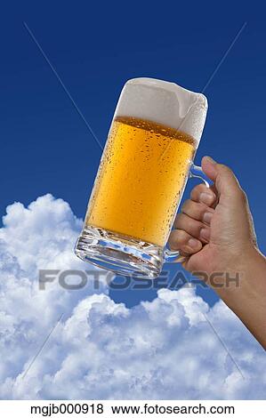 Beer and blue sky with clouds View Large Photo Image Stock Photo - Beer and blue sky with clouds. Fotosearch
