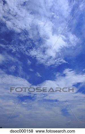 Blue sky with clouds View Large Photo Image Stock Photo - Blue sky with clouds. Fotosearch