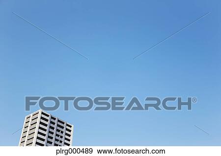 Building and blue sky View Large Photo Image Stock Photo - Building and blue sky. Fotosearch