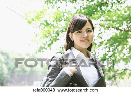 Businesswoman smiling at camera View Large Photo Image Stock Photo - Businesswoman smiling at camera. Fotosearch