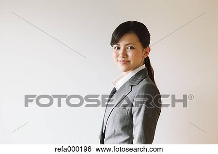Businesswoman smiling at camera View Large Photo Image Stock Photograph - Businesswoman smiling at camera. Fotosearch