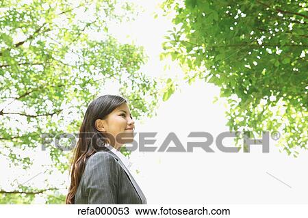 Businesswoman smiling away View Large Photo Image Stock Image - Businesswoman smiling away. Fotosearch