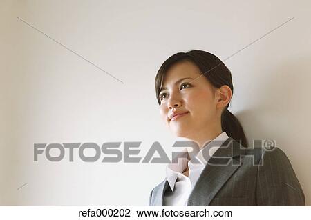 Businesswoman smiling away View Large Photo Image Stock Image - Businesswoman smiling away. Fotosearch
