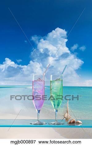 Cocktails and blue sky with clouds View Large Photo Image Stock Photo - Cocktails and blue sky with clouds. Fotosearch