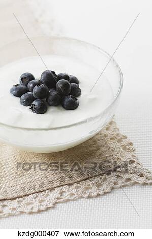 Cup of yogurt and blueberries View Large Photo Image Stock Photo - Cup of yogurt and blueberries. Fotosearch