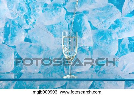 Stock Image - Glass of water and ice. Fotosearch