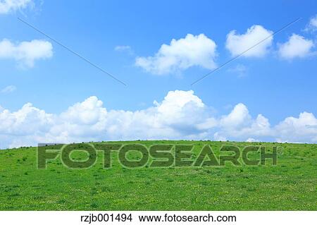 Grassland and sky with clouds, Hokkaido View Large Photo Image Picture - Grassland and sky with clouds, Hokkaido. Fotosearch