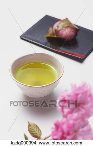 Green tea and cherry blossom rice cake View Large Photo Image Picture - Green tea and cherry blossom rice cake. Fotosearch