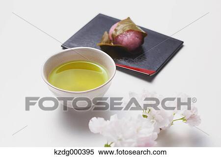Green tea and cherry blossom rice cake View Large Photo Image Stock Photography - Green tea and cherry blossom rice cake. Fotosearch